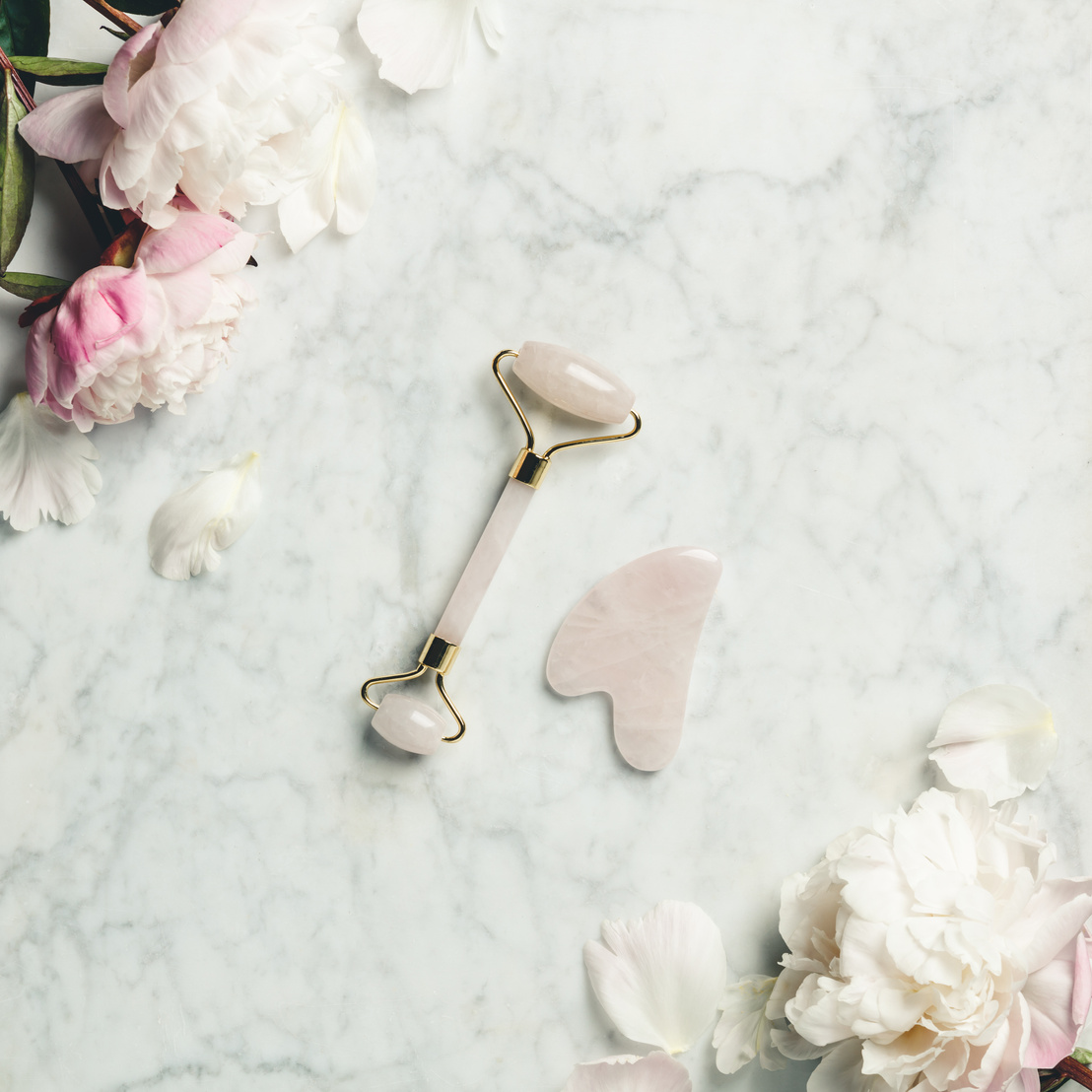 Jade Roller on Marble Background